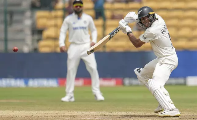 New Zealand's Rachin Ravindra plays a shot during the day five of the first cricket test match between India and New Zealand at the M.Chinnaswamy Stadium, in Bengaluru, India, Sunday, Oct. 20, 2024. (AP Photo/Aijaz Rahi)