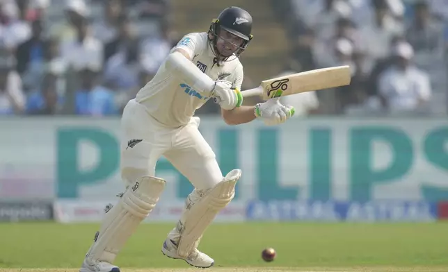 New Zealand's captain Tom Latham plays a shot during the day one of the second cricket test match between India and New Zealand at the Maharashtra Cricket Association Stadium , in Pune, India, Thursday, Oct. 24, 2024. (AP Photo/Rafiq Maqbool)