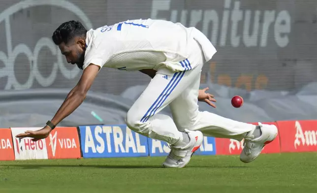 India's Mohammad Siraj fields the ball to save a boundary during the day three of the first cricket test match between India and New Zealand at the M.Chinnaswamy Stadium, in Bengaluru, India, Friday, Oct. 18, 2024. (AP Photo/Aijaz Rahi)