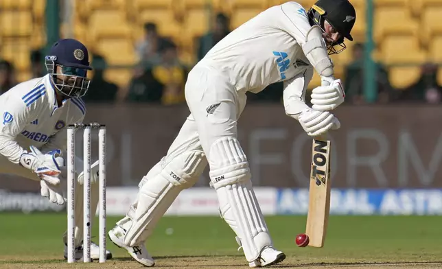 New Zealand's Devon Conway plays a shot during the day two of the first cricket test match between India and New Zealand at the M.Chinnaswamy Stadium, in Bengaluru, India, Thursday, Oct. 17, 2024. (AP Photo/Aijaz Rahi)