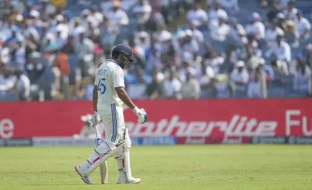 India's captain Rohit walks off the field after losing his wicket during the day three of the second cricket test match between India and New Zealand at the Maharashtra Cricket Association Stadium , in Pune, India, Saturday, Oct. 26, 2024. (AP Photo/Rafiq Maqbool)