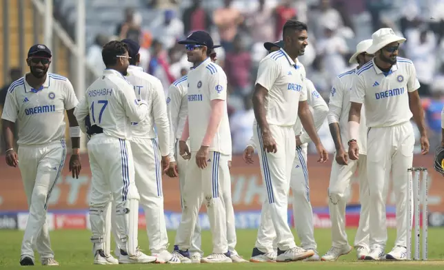 India's Ravichandran Ashwin , second from right, celebrates the dismissal of New Zealand's Will Young with his team players during the day one of the second cricket test match between India and New Zealand at the Maharashtra Cricket Association Stadium , in Pune, India, Thursday, Oct. 24, 2024. (AP Photo/Rafiq Maqbool)