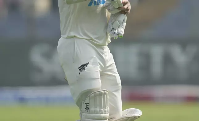 New Zealand's captain Tom Latham walks off the field after losing his wicket during the day one of the second cricket test match between India and New Zealand at the Maharashtra Cricket Association Stadium , in Pune, India, Thursday, Oct. 24, 2024. (AP Photo/Rafiq Maqbool)