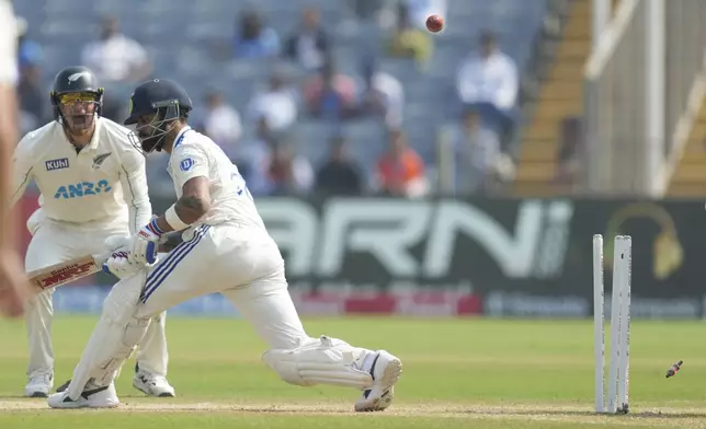 India's Virat Kohli is bowled out during the day two of the second cricket test match between India and New Zealand at the Maharashtra Cricket Association Stadium , in Pune, India, Friday, Oct. 25, 2024. (AP Photo/Rafiq Maqbool)