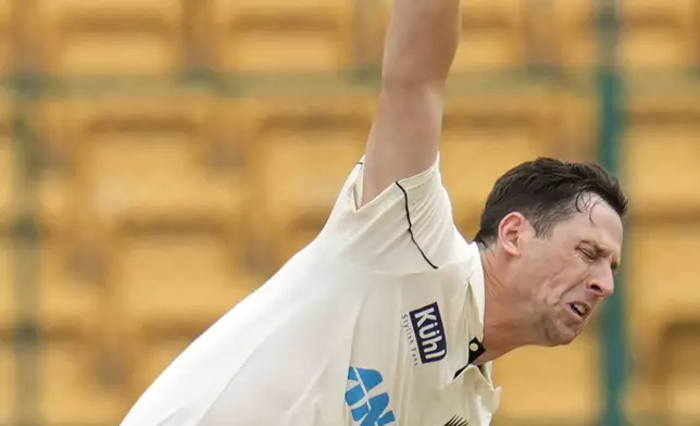 New Zealand's Matt Henry bowls a delivery during the day two of the first cricket test match between India and New Zealand at the M.Chinnaswamy Stadium, in Bengaluru, India, Thursday, Oct. 17, 2024. (AP Photo/Aijaz Rahi)