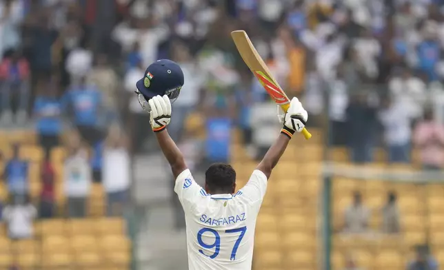 India's Sarfaraz Khan celebrates after scoring a century during the day four of the first cricket test match between India and New Zealand at the M.Chinnaswamy Stadium, in Bengaluru, India, Saturday, Oct. 19, 2024. (AP Photo/Aijaz Rahi)