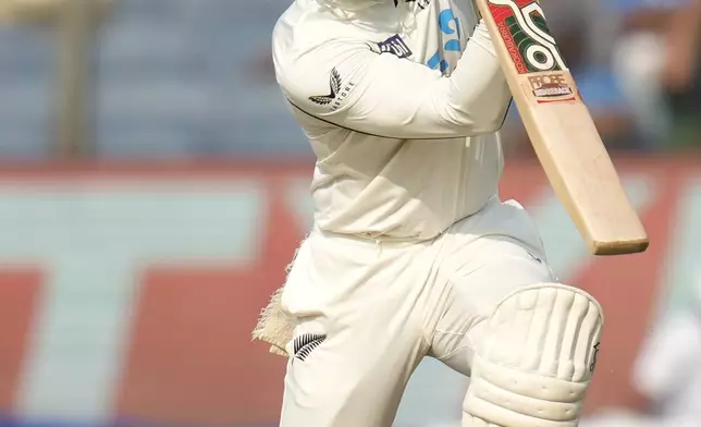 New Zealand's Tom Blundell plays a shot during the day two of the second cricket test match between India and New Zealand at the Maharashtra Cricket Association Stadium , in Pune, India, Friday, Oct. 25, 2024. (AP Photo/Rafiq Maqbool)