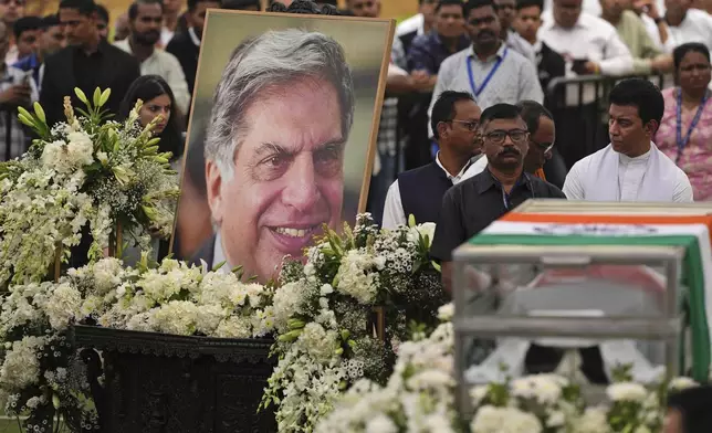 People pay homage to Indian business leader Ratan Tata who died on Wednesday night, in the lawns of the National Centre for the Performing Arts (NCPA), in Mumbai, India, Thursday, Oct. 10, 2024. (AP Photo /Rafiq Maqbool)