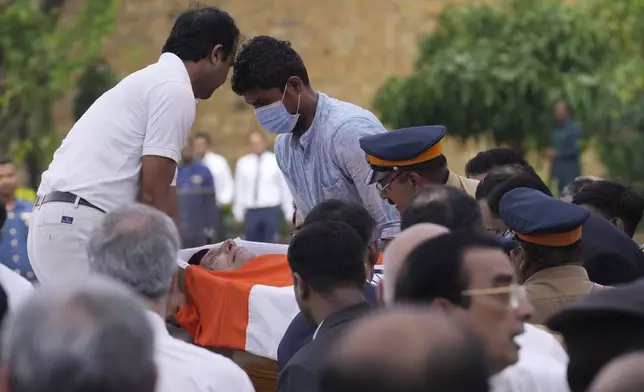 The body of Indian business leader Ratan Tata who died on Wednesday night is taken to the NCPA Lawns for the public to pay homage in Mumbai, India, Thursday, Oct. 10, 2024. (AP Photo/Rajanish Kakade)