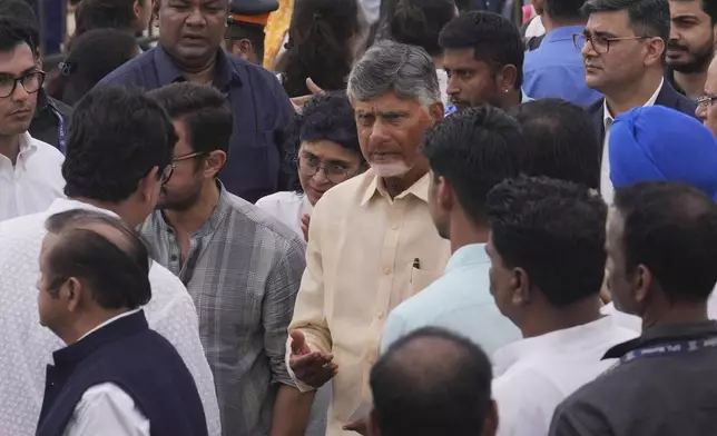 Indian state of Andhra Pradesh Chief Minister N Chandrababu Naidu,center, arrives to pay tributes to Indian business leader Ratan Tata who died on Wednesday night, in Mumbai, India, Thursday, Oct. 10, 2024. (AP Photo /Rafiq Maqbool)