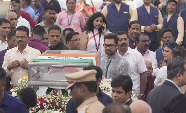 Bollywood actor Aamir Khan, center, pays tributes to Indian business leader Ratan Tata who died on Wednesday night, in Mumbai, India, Thursday, Oct. 10, 2024. (AP Photo /Rafiq Maqbool)