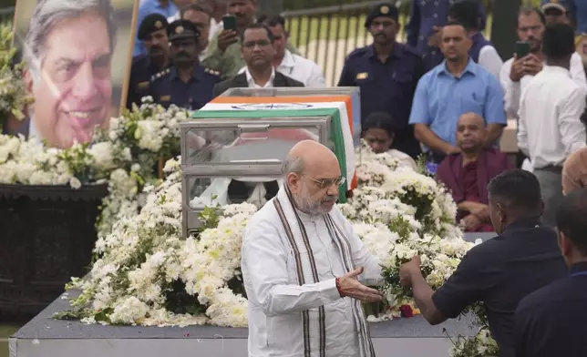 Indian Home Minister Amit Shah pays tributes to Indian business leader Ratan Tata who died on Wednesday night, in Mumbai, India, Thursday, Oct. 10, 2024. (AP Photo /Rafiq Maqbool)