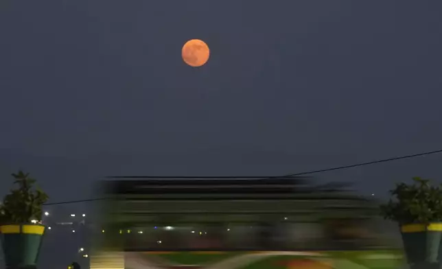 A supermoon rises on the sky as traffic move at Tawi bridge in Jammu, India, Thursday, Oct. 17, 2024.(AP Photo/Channi Anand)