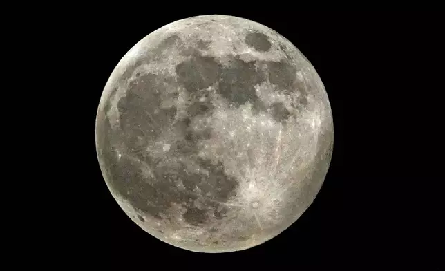 A supermoon rises above Delhi's skyline in New Delhi, India, Thursday, Oct. 17, 2024. (AP Photo/Manish Swarup)