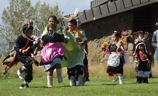 FILE - Hopi children dance in front of City Hall on Indigenous Peoples Day in Flagstaff, Ariz., Oct. 10, 2022. (AP Photo/Felicia Fonseca, File)