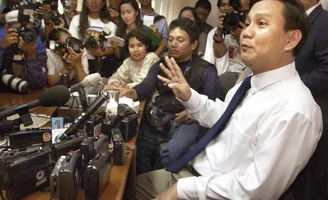 FILE- Retired Indonesian Lt. Gen. Prabowo Subianto, former leader of the elite Kopassus special forces, tells his side of the story during his first news conference since his return to Jakarta, May 9, 2000, where he denied masterminding the May 1998 riots and violence in Aceh, Irian Jaya, and East Timor. (AP Photo/Charles Dharapak, File)