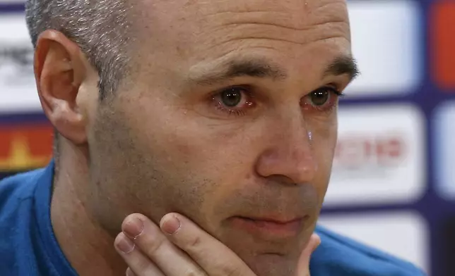 FILE - Barcelona's Andres Iniesta reacts during a news conference announcing he is leaving the club, in Barcelona, Spain, on April. 27, 2018. Andres Iniesta who scored Spain's World Cup-winning goal in 2010 and was one of the key players who made Barcelona's tiki-taka thrive for so long, announced his retirement from soccer on Tuesday. (AP Photo/Manu Fernandez, File)