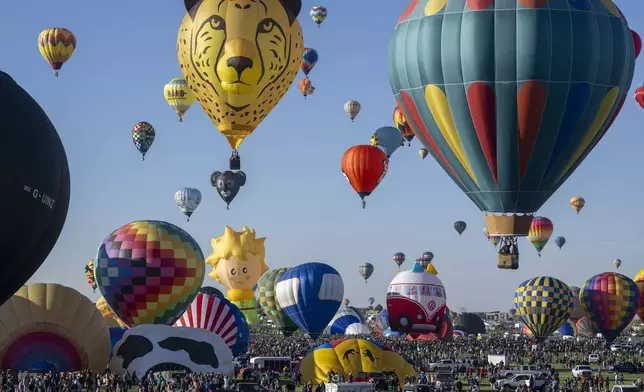 FILE - Nearly 500 balloons begin to take off during the Albuquerque International Balloon Fiesta, Oct. 7, 2023, in Albuquerque, N.M. (AP Photo/Roberto E. Rosales, File)