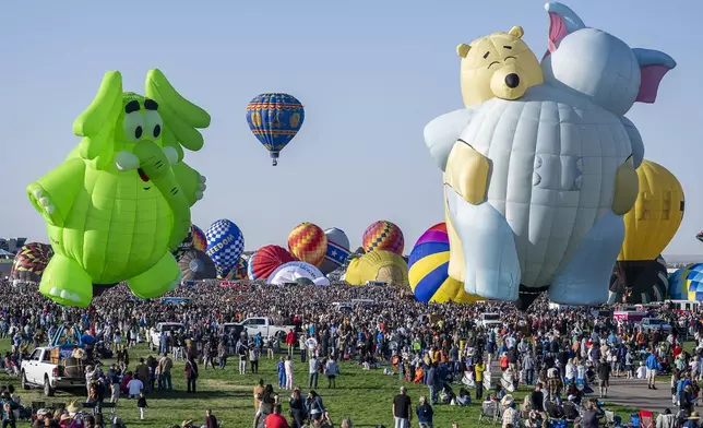 Hot air balloons take off during the mass ascension at the 52nd Albuquerque International Balloon Fiesta in Albuquerque, N.M., on Saturday, Oct. 5, 2024. (AP Photo/Roberto E. Rosales)