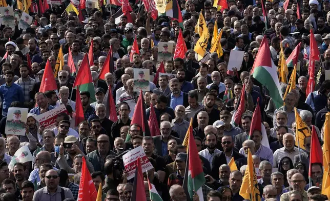 People attend the funeral ceremony of the late Iranian Revolutionary Guard Gen. Abbas Nilforushan, who was killed in an Israeli airstrike in Beirut in late September, in Tehran, Iran, Tuesday, Oct. 15, 2024. (AP Photo/Vahid Salemi)