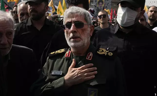 Commander of the Iran's Revolutionary Guard Quds Force, Gen. Esmail Qaani, mourns during the funeral ceremony of the late Revolutionary Guard Gen. Abbas Nilforushan, who was killed in an Israeli airstrike in Beirut in late September, in Tehran, Iran, Tuesday, Oct. 15, 2024. (AP Photo/Vahid Salemi)