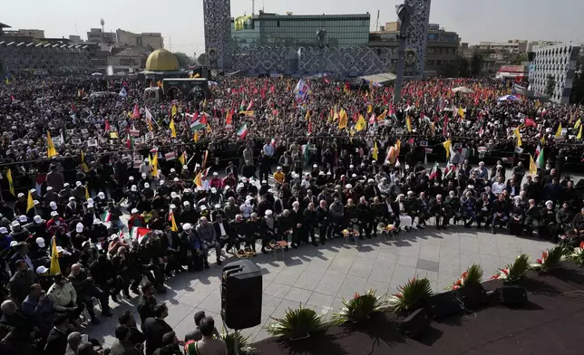 People and officials attend the funeral ceremony of the late Iranian Revolutionary Guard Gen. Abbas Nilforushan, who was killed in an Israeli airstrike in Beirut in late September, in Tehran, Iran, Tuesday, Oct. 15, 2024. (AP Photo/Vahid Salemi)