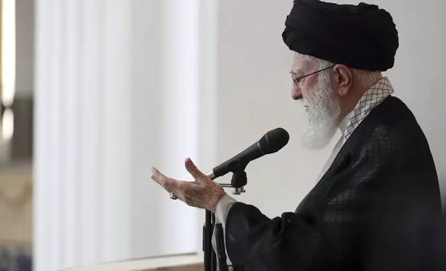 In this photo released by the official website of the office of the Iranian supreme leader, Supreme Leader Ayatollah Ali Khamenei gestures as he delivers his sermon during Friday prayers at Imam Khomeini grand mosque, in Tehran, Iran, Friday, Oct. 4, 2024. (Office of the Iranian Supreme Leader via AP)