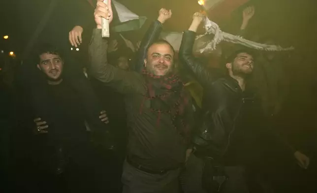 Demonstrators celebrate Iran's missile strike against Israel during a gathering in front of the British Embassy in Tehran, Iran, Tuesday, Oct. 1, 2024. (AP Photo/Vahid Salemi)