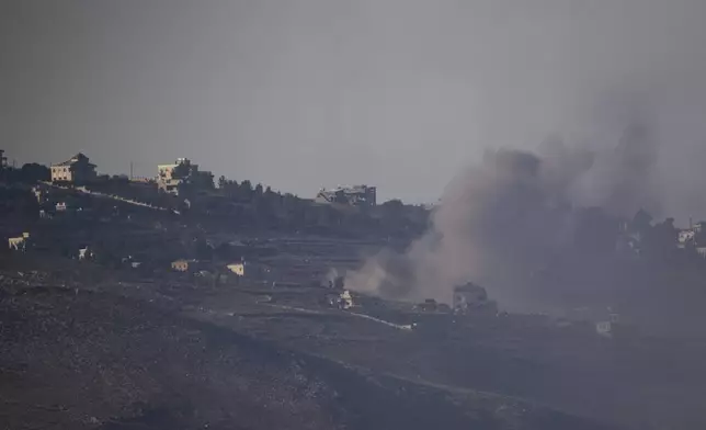 Smoke rises following an Israeli shelling in southern Lebanon as seen from northern Israel, Friday, Oct. 4, 2024. (AP Photo/Leo Correa)