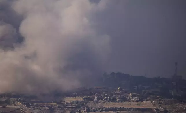 Smoke rises following an explosion in southern Lebanon as seen from northern Israel, Monday, Oct. 7, 2024. (AP Photo/Leo Correa)