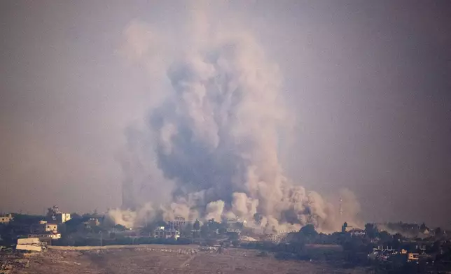 Smoke rises following an explosion in southern Lebanon as seen from northern Israel, Monday, Oct. 7, 2024. (AP Photo/Leo Correa)