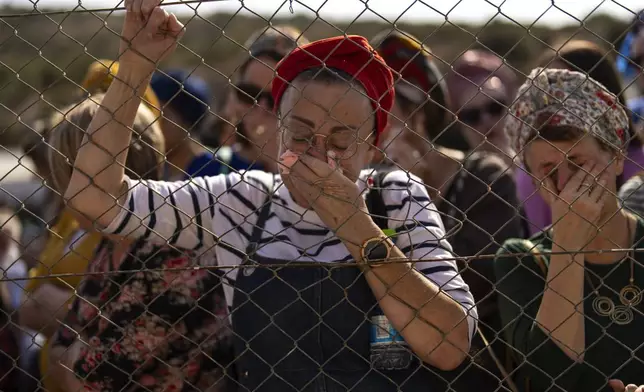 Relatives and friends mourn during the funeral of Israeli reservist Yedidia Bloch, 31, at Mevo Horon settlement, West Bank, Wednesday, Oct. 30, 2024. Bloch died on Tuesday 29 after he was injured in Lebanon. (AP Photo/Francisco Seco)