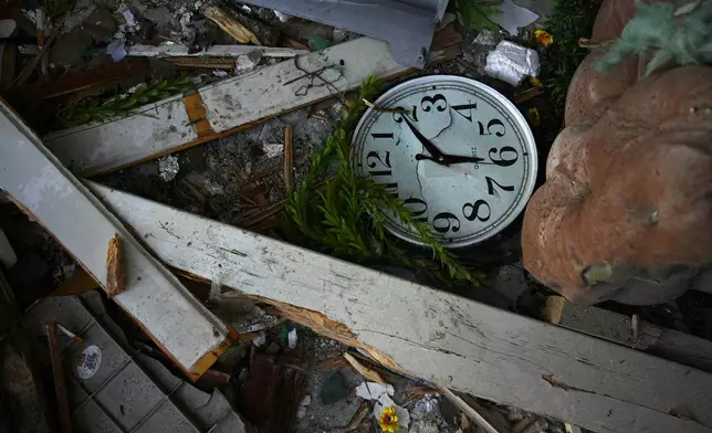 Damage to a home struck by a rocket fired from Lebanon in the town of Majd al-Krum , northern Israel, Wednesday, Oct. 16, 2024. (AP Photo/Ariel Schalit)