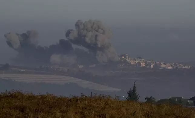 Smoke rises following Israeli bombardment in southern Lebanon as seen from northern Israel, Sunday, Oct. 6, 2024. (AP Photo/Baz Ratner)