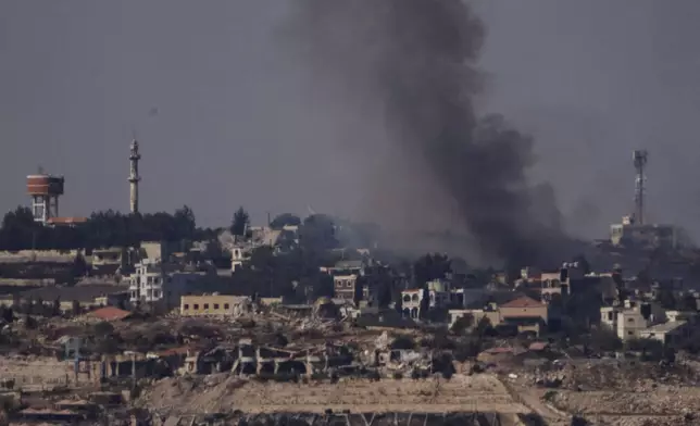 Smoke rises from a fire in southern Lebanon as seen from northern Israel, Saturday, Oct. 5, 2024. (AP Photo/Leo Correa)