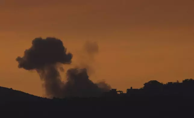 Smoke rises following an explosion in southern Lebanon as seen from northern Israel, Sunday, Oct. 20, 2024. (AP Photo/Leo Correa)