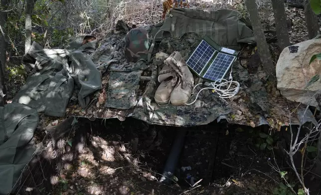 Israeli soldiers display to the media what they say is Hezbollah gear found during their ground operation in southern Lebanon, near the border with Israel, Sunday, Oct. 13, 2024. (AP Photo/Sam McNeil)