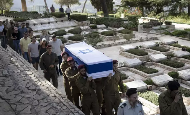 Soldiers carry the coffin of Israeli Army Capt. Eitan Yitzhak Oster, who was killed in action in Lebanon, during his funeral at Mt. Herzl military cemetery in Jerusalem, Wednesday, Oct. 2, 2024. (AP Photo/Maya Alleruzzo)