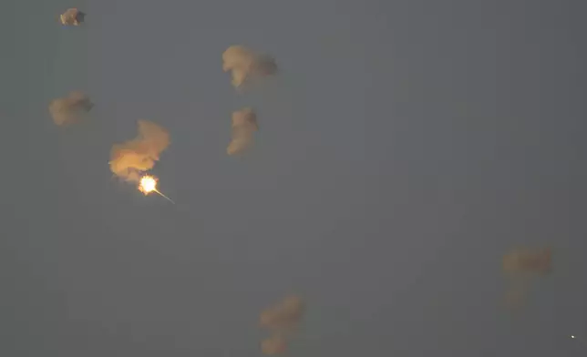 Israeli Iron Dome air defense system fires to intercept rockets that were launched from Lebanon, in northern Israel, Friday, Oct. 4, 2024. (AP Photo/Leo Correa)