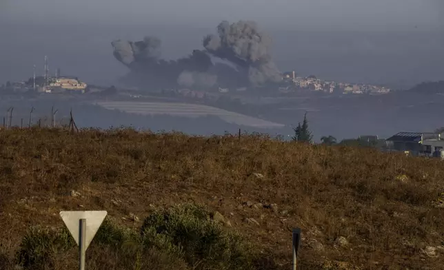 Smoke rises following Israeli bombardment in southern Lebanon as seen from northern Israel, Sunday, Oct. 6, 2024. (AP Photo/Baz Ratner)