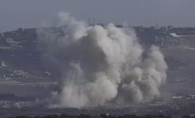 Smoke rises following an Israeli bombardment in southern Lebanon as seen from northern Israel, Friday, Oct. 4, 2024. (AP Photo/Baz Ratner)