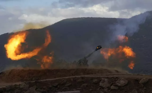 An Israeli mobile artillery unit fires a shell from northern Israel towards Lebanon, Wednesday, Oct. 2, 2024. (AP Photo/Baz Ratner)