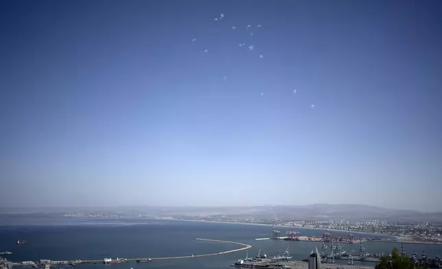 Projectiles fired from Lebanon are intercepted over Haifa, Israel, Wednesday, Oct. 23, 2024. (AP Photo/Maya Alleruzzo)