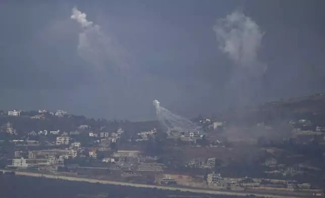 Israeli shelling hits an area in southern Lebanon as seen from northern Israel, Tuesday, Oct. 1, 2024. (AP Photo/Leo Correa)