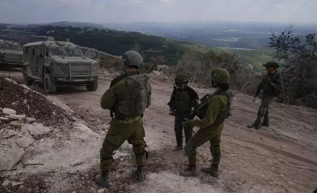 Israeli soldiers are seen during a ground operation in southern Lebanon, near the border with Israel, Sunday, Oct. 13, 2024. (AP Photo/Sam McNeil)