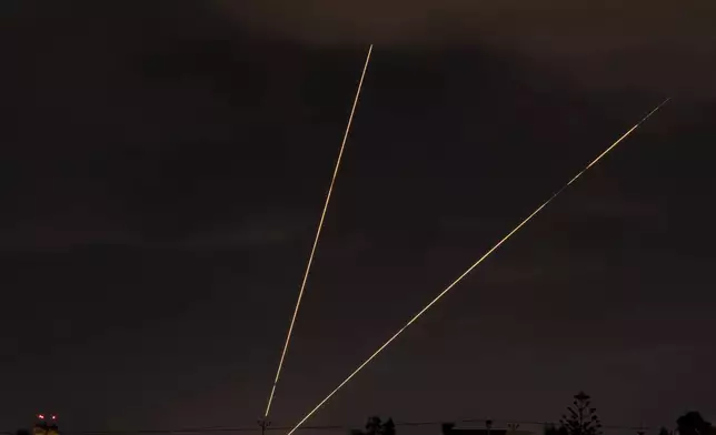 Israeli air defense system fires to intercept rockets over Hadera, Israel, Tuesday, Oct. 1, 2024. (AP Photo/Ariel Schalit)