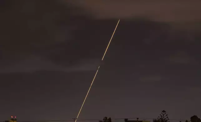 Israeli air defense system fires to intercept rockets fired from Iran, Tuesday, Oct. 1, 2024, over Hadera, Israel. (AP Photo/Ariel Schalit)