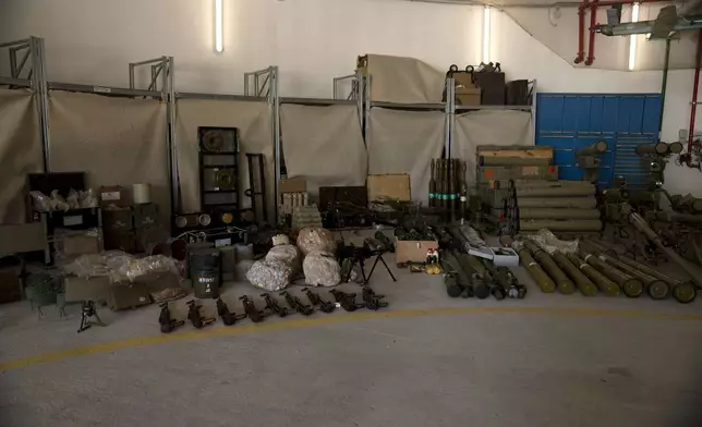 Weapons used by Hezbollah seized during combat operations in Lebanon are displayed during a government-organized media tour on a base in southern Israel, Wednesday, Oct. 9, 2024. (AP Photo/Maya Alleruzzo)