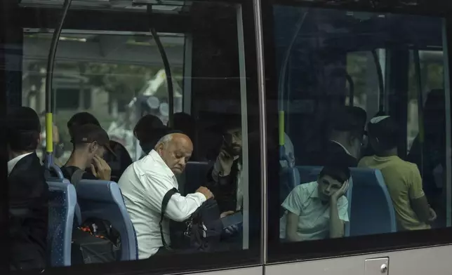 People travel by light rail in Jerusalem on Wednesday, Sept.18, 2024. (AP Photo/Ohad Zwigenberg)