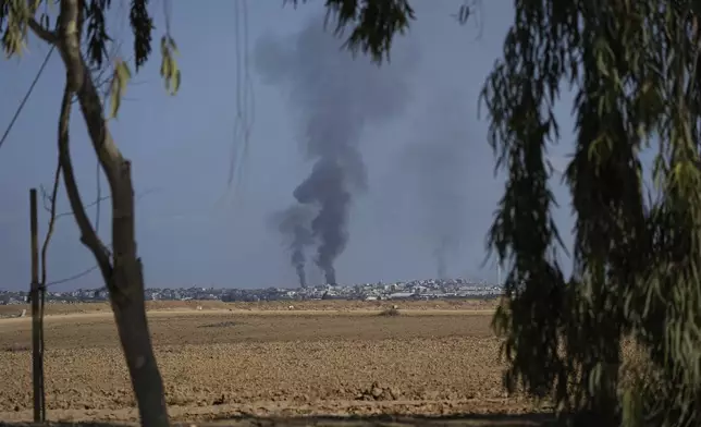 Smoke from Israeli bombardment rises from the Gaza Strip, as seen from southern Israel, Wednesday, Oct. 16, 2024. (AP Photo/Tsafrir Abayov)